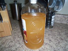 a bottle of liquid sitting on top of a counter