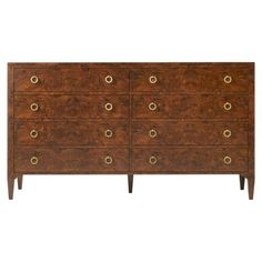 an antique chest of drawers with brass pulls and knobs on the front, against a white background