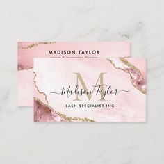 a business card with the letter m on it in pink marble and gold glitters