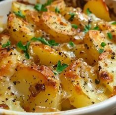 a white bowl filled with potatoes covered in seasoning