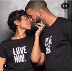 a man and woman wearing love him t - shirts