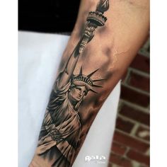 the statue of liberty tattoo on the arm