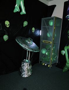 an alien themed display in a dark room