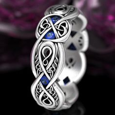 See all variations of this ring design: www.etsy.com/shop/CelticEternity?search_query=1411 Intricate infinity symbols weave through this Celtic ring, representing limitless love and infinite possibilities. Nestled between the unbroken loops are trinity knots, symbolizing eternal love and longevity, Mens Celtic Wedding Bands, Silver Sapphire Ring, Celtic Shield, Silver Infinity Ring, Celtic Wedding Bands, Emerald Wedding Band, Infinity Ring Wedding, Love Knot Ring, Sapphire Wedding Band