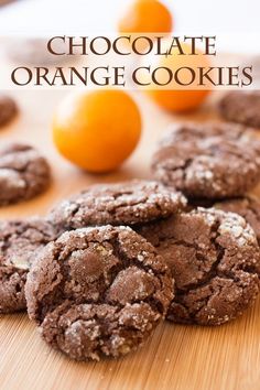 chocolate orange cookies on a cutting board with tangerines in the background and text overlay