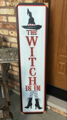 a sign that says the witch is in