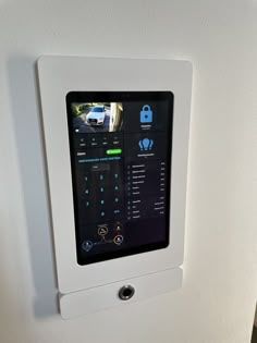 an appliance mounted to the side of a refrigerator door with buttons and icons on it