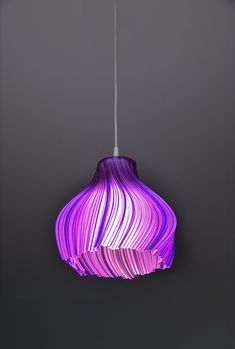 a purple light hanging from a ceiling