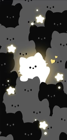 a bunch of black and white teddy bears with glowing lights in the dark, all looking like cats