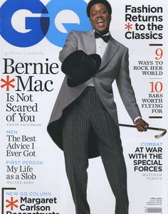 a man in a tuxedo on the cover of gq magazine, wearing a bow tie and holding a cane