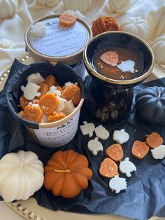 some pumpkins and other treats are on a table