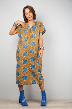 "Orange Ankara dress | African Print shirt Dress | holiday resort dress | Women's summer cotton dress  This women's dress is from a quality Ankara cotton and has very tidy sewing and is made with the highest care.   Original Design and produced by NUICHAN     PRODUCT SIZE : One Size Fits Most *Chest : up to 42\" *Sleeve length : 9\" (from neckline to hem) *Waist : up to 40\"   *Hips : up to 42\" *Length : 43\" from shoulder to hem NOTE :  * Model chest : 32\", waist : 24\" hips : 35\"  * Combine Ankara Shirt Dress, African Print Shirt, Resort Dress, Dress African, Colorful Dress, Collared Dress, Ankara Style, Resort Dresses, Holiday Resort