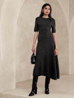 This unique sweater dress is knitted from a warm wool blend, using a special godet panel at the skirt to create its asymmetrical hem.  Column fit.  Responsible Wool Standard Certified: This global standard protects the sheep that supply the wool for this garment as well as the land they graze, working to make it better for the environment and the sheep.  Crew neck.  Unlined.  Column fit.  Elbow-length sleeves.  Midi length.  Model: Size S, 5'10" (178cm). Work Dress Code, Unique Sweaters, Long Sweater Dress, Pinterest Fashion, Business Dresses, Outfits Casual, Winter Dresses, Cocktail Dress Party, Women's Dresses