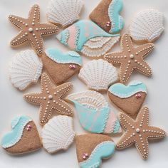 decorated cookies in the shape of seashells and starfish