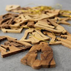 wooden ornaments are laid out on the floor