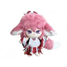 a pink stuffed animal with big ears and purple eyes