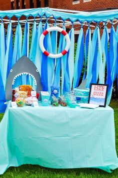 a table with blue and white decorations on it