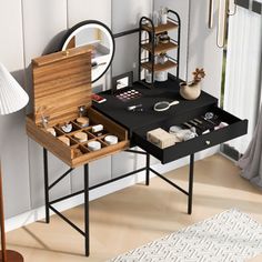 a table with two drawers and a mirror on it