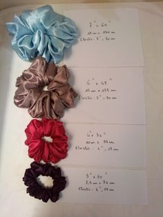 four scrunffles are laid out on top of a sheet of paper with measurements