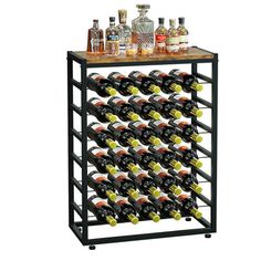 a wine rack with many bottles and glasses on the top, filled with liquors