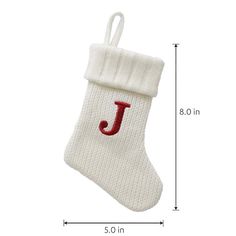 a white christmas stocking with the letter j on it's side and a red initial