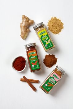 various spices and herbs on a white surface with ginger, turment, cinnamon, ginger powder