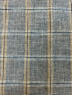 an upholstered blue and yellow plaid fabric