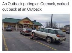 an outback pulling an outback, parked out back at an outback restaurant