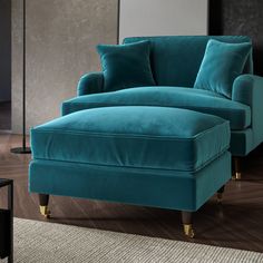 a blue chair and ottoman in a living room