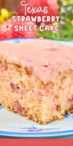 a close up of a piece of cake on a plate with strawberries in the background