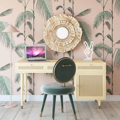 a desk with a mirror, chair and laptop on it in front of a palm tree wallpaper