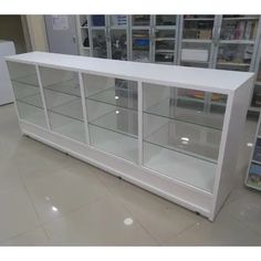 a white display case with glass doors in a store