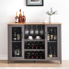 a wine cabinet with several bottles and glasses