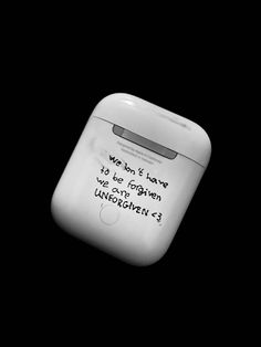 an apple airpods with a message written on it