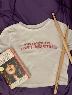 who else is grieving this line from the book not making into the song? well here's your chance to give it justice by wearing it proudly 🎸🤩 this baby tee inspired by the book by TJR is hand embroidered by me and can be made in any size! i can also make it in a tank, regular t shirt, or baseball tee like in pic 7! Music T Shirt, Upcycle Tshirt, Book Tshirts, Rock N’roll, Rock'n Roll, Aesthetic Words, Infant Tees, Rock N Roll, Hand Embroidered