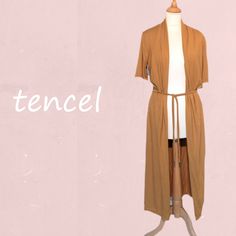 "*Long open cardigan with shawl collar and summery half-length sleeves. Removable waist cord. Made of very supple Tencel, soft and shiny and feeling as silk.   *FABRIC; 95 % Tencel (CLY)  5% elasthan. Tencel (Lyocell) is a relatively new fabric. This fabric has the luxurious feel of silk, is very strong and even better  moisturing than cotton. It's just like viscose made from cellulose (wood chips of the eucalyptus tree) and is therefore also called \"the new viscose\". The production process ( Brown V-neck Summer Cardigan, Versatile Solid Summer Cardigan, Versatile Solid Color Summer Cardigan, Summer Open Front Layering Shrug, Long Solid Summer Cardigan, Summer Layering Open Front Shrug, Summer Open Front Shrug For Layering, Summer Short Sleeve Stretch Cardigan, Summer Stretch Short Sleeve Cardigan