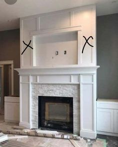 the fireplace is being built with two x marks on it and there are no people around