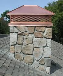 a brick chimney on the roof of a house