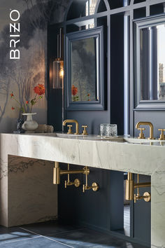 a bathroom with two sinks and mirrors on the wall next to each other in front of an arched window