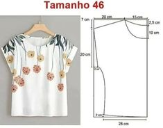 a white blouse with flowers on it and measurements