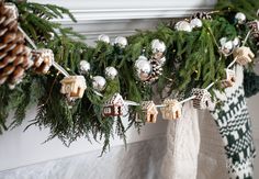 christmas stockings hanging from a mantle with ornaments