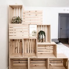 wooden crates stacked on top of each other in a room