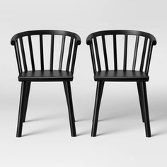 two black chairs sitting next to each other