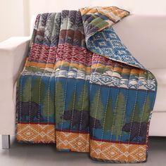 a couch with a blanket on top of it