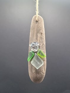 This Rustic Driftwood Seaglass Angel Ornament is a charming addition to your coastal décor. Handcrafted from natural driftwood and adorned with delicate seaglass accents, this ornament captures the essence of the sea. Hang it on your Christmas tree or display it year-round as a reminder of the beach. Its unique and rustic design will bring a touch of coastal charm to any room in your home. Key Features: - Handcrafted from natural driftwood - Adorned with delicate seaglass accents - Unique rustic design - Perfect for Christmas tree or year-round display Add a touch of seaside charm to your home with this Rustic Driftwood Seaglass Angel Ornament. Each ornament is crafted by hand using natural driftwood and adorned with beautiful seaglass accents, making each piece unique in its own way. Hang Driftwood Christmas Crafts, Beach Glass Ornaments, Seaglass Angel, Driftwood Christmas Decorations, Driftwood Village, Driftwood Tree, Seashell Art Diy, Sea Glass Art Diy, Driftwood Christmas Tree