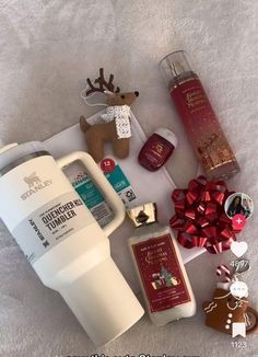 the contents of a christmas gift laid out on a bed