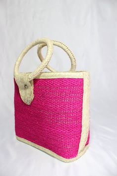 Straw purses are handcrafted by indigenous women from Mexico. They are very strong and resistant and come in different colors like pink, or multicolored. There are three different sizes which are a small, medium and large. The large measures 13½ inches wide, 5 ½ inches long and 19 inches tall include the handle. The medium is 11½ inches wide, 4 ¼ inches long and 16 inches tall including the handle. Handmade Pink Straw Tote Bag, Handmade Pink Straw Bag For Everyday Use, Pink Handmade Straw Bag For Everyday Use, Pink Woven Straw Bag For Market, Handmade Pink Straw Bag For Travel, Handmade Eco-friendly Pink Straw Bag, Eco-friendly Handmade Pink Straw Bag, Traditional Pink Tote Bag, Traditional Pink Beach Bag