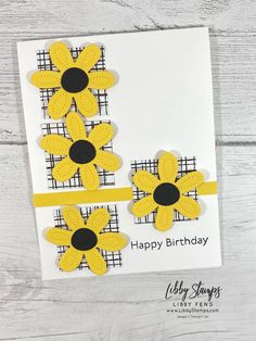 a card with yellow flowers on it and the words happy birthday written in black ink