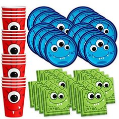 a bunch of paper cups with eyes on them and some money in front of it