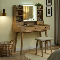 a dressing table with a mirror and stool in front of a wall mounted light above it